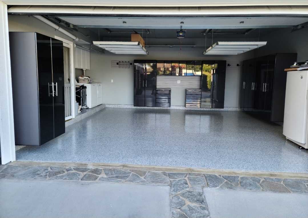 Garage cement coating under black cabinets