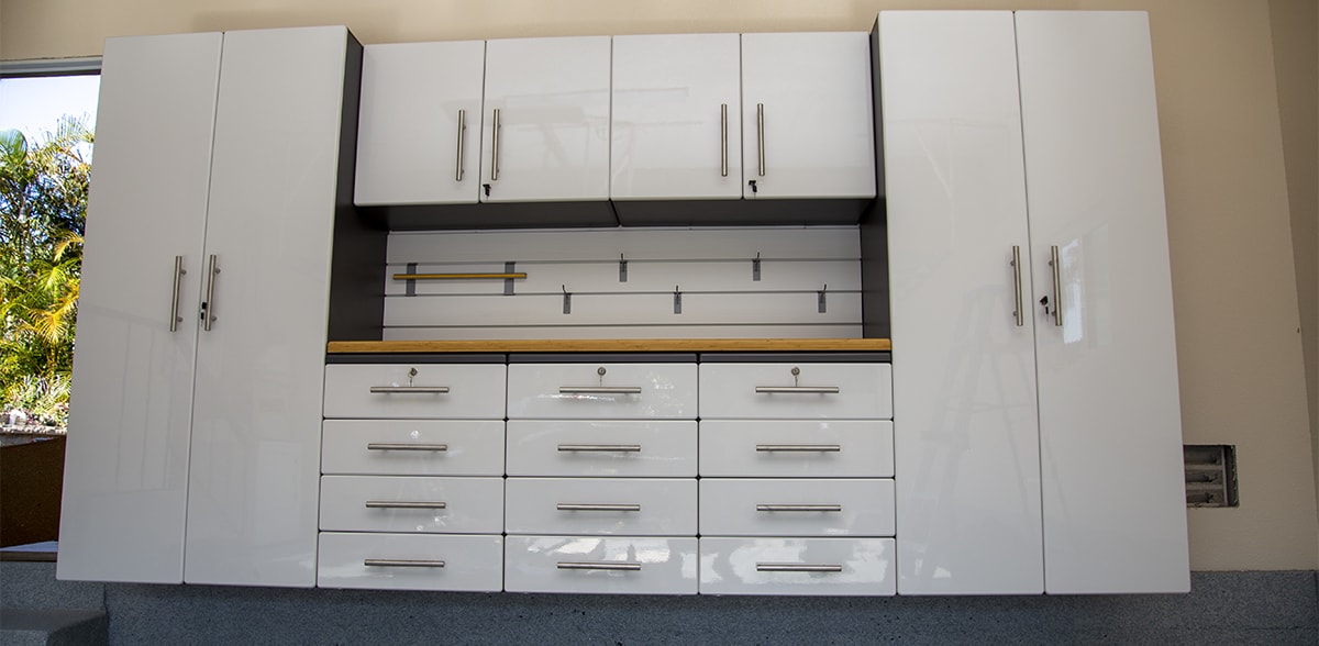 white-cabinets-with-bench Custom designed Garage cabinets